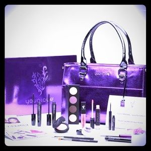 Makeup and purple leather purse
